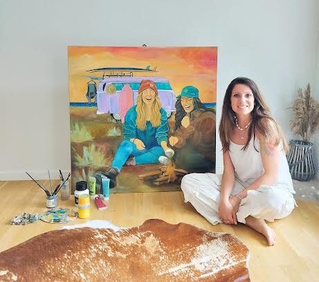 Alessia in the studio with one of her original paintings