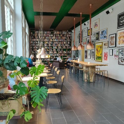 paint and wine Copenhagen workshop at Riccos Kaffebar Sydhavn with canal view, guests painting and enjoying wine and snacks